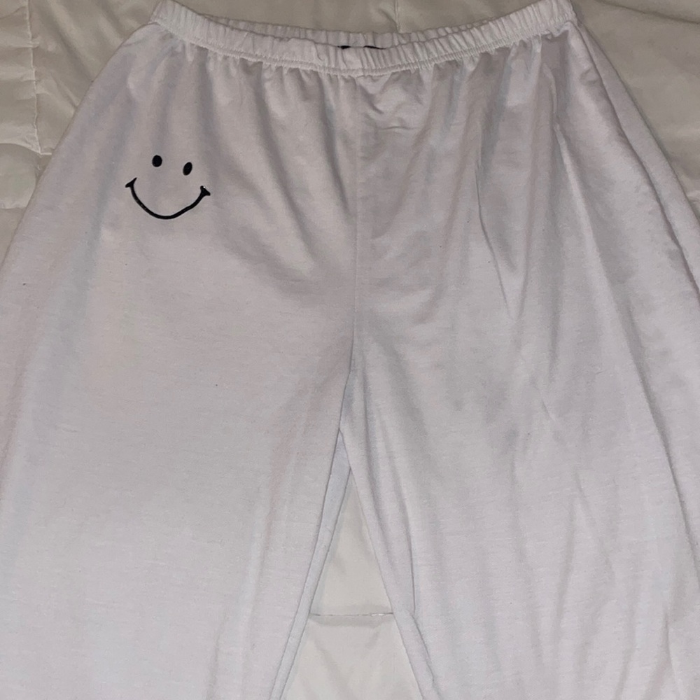 white smiley sweatpants